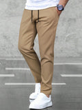 Men Solid Slant Pocket Drawstring Waist Pants