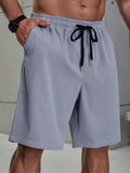 Loose Fit Men Plus Size Shorts With Drawstring Waist And Slant Pockets